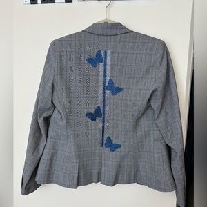 Hipchik grey blazer with butterfly stripe design on back.
